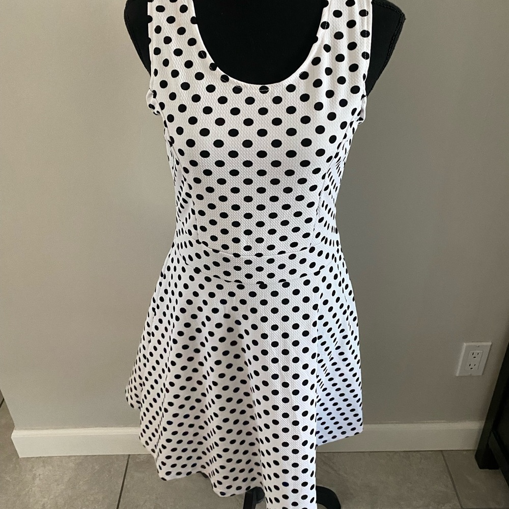 White with black polka dot mini dress.